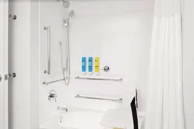 a bathroom with a sink and a shower at Tru By Hilton Cleveland Midtown in Cleveland
