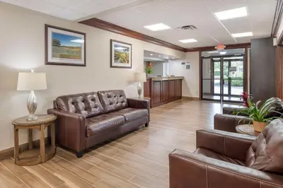 a waiting room with leather furniture in a hospital at Best Western Mason Inn in Mason