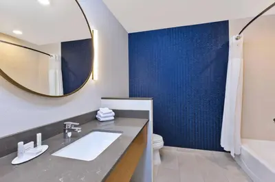 a bathroom with a sink and a mirror at Fairfield Inn & Suites by Marriott Cincinnati Airport South/Florence in Florence