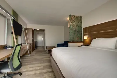a hotel room with a bed and a desk at Holiday Inn Express & Suites Wapakoneta by IHG in Wapakoneta