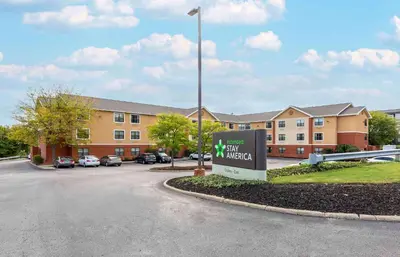 a sign in front of a building with a parking lot at Extended Stay America Suites - Akron - Copley - East in Copley