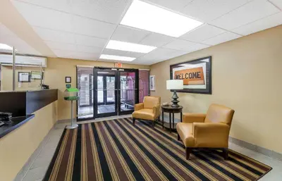 a lobby with two chairs and a waiting room at Extended Stay America Suites - Akron - Copley - East in Copley