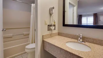 a bathroom with a sink and a toilet and a phone at Best Western Clermont in Cincinnati