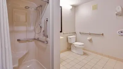 a bathroom with a toilet and a shower in it at Best Western Clermont in Cincinnati