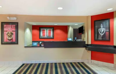 a lobby of a fast food restaurant with red walls at Extended Stay America Select Suites - Columbus - Worthington in Worthington