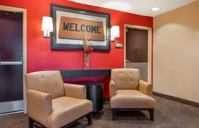 a waiting room with two chairs and a welcome sign at Extended Stay America Select Suites - Columbus - Worthington in Worthington