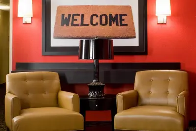 two chairs and a lamp in a waiting room at Extended Stay America Select Suites - Columbus - Worthington in Worthington