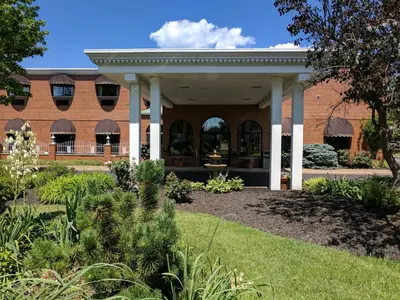 a garden in front of a brick building at South Shore Inn in Sandusky