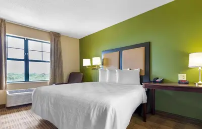 a hotel room with a large bed and a window at Extended Stay America Suites - Cincinnati - Florence - Turfway Rd in Florence
