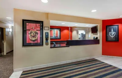 a lobby of a hospital with red walls at Extended Stay America Suites - Cleveland - Brooklyn in Brooklyn