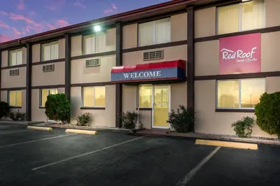 a rendering of a red roof building with a parking lot at Red Roof Inn & Suites Wapakoneta in Wapakoneta