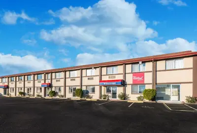 an empty parking lot in front of a hotel at Red Roof Inn & Suites Wapakoneta in Wapakoneta