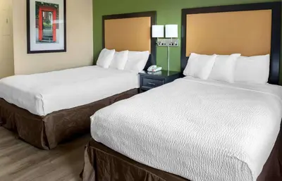 two beds sitting next to each other in a hotel room at Extended Stay America Suites - Columbus - NE - I-270 in Gahanna