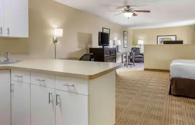 a hotel room with a kitchen and a living room at Extended Stay America Suites - Columbus - NE - I-270 in Gahanna