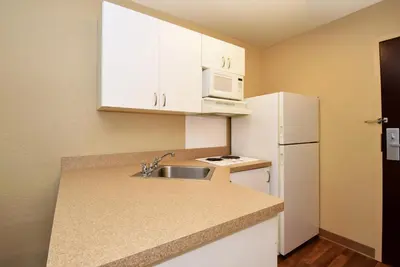 a small kitchen with a sink and a white refrigerator at Extended Stay America Suites - Columbus - Dublin in Dublin