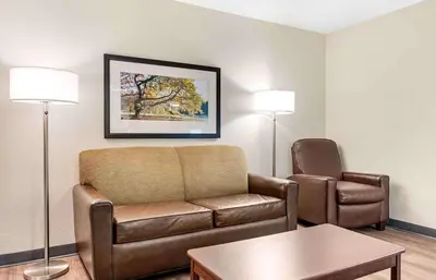 a living room with a couch and a chair at Extended Stay America Suites - Dayton - North in Dayton