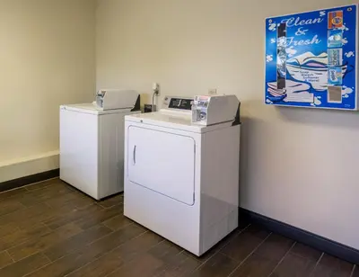 two washers and a dryer in a room at Red Roof Inn PLUS+ Columbus - Dublin in Dublin