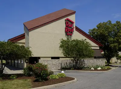 a restaurant with a sign on the side of a building at Red Roof Inn Toledo - Maumee in Maumee