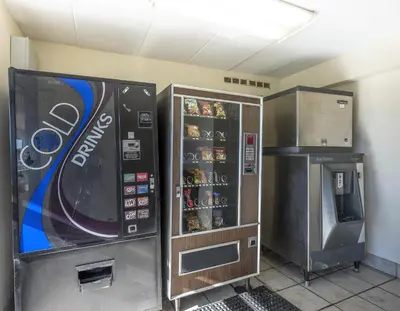 two vending machines and a drink cooler in a room at Red Roof Inn Columbus East- Reynoldsburg in Brice