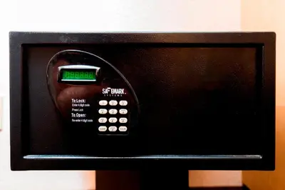 a microwave oven with a clock on top of it at Red Roof Inn Canton in Canton