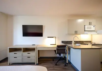 a kitchen with a desk with a sink and a microwave at Extended Stay America Suites - Cleveland - Beachwood - Orange Place - South in Orange