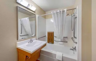 a white bathroom with a sink and a shower at Extended Stay America Select Suites - Cleveland - Mentor in Mentor