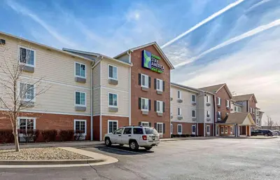 a hotel with a car parked in a parking lot at Extended Stay America Select Suites - Cleveland - Mentor in Mentor