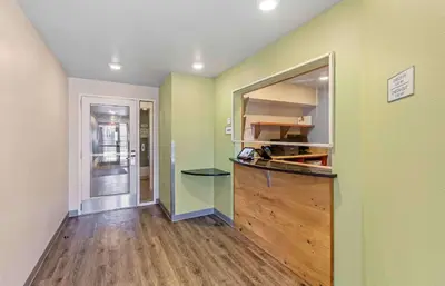a kitchen with green walls and a wooden counter at Extended Stay America Select Suites - Cleveland - Mentor in Mentor