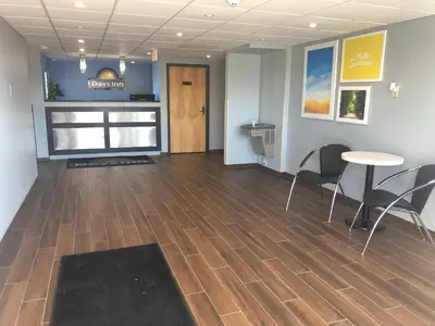a room with a table and chairs and a table and a table and chairs at Days Inn by Wyndham Grove City Columbus South in Grove City