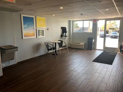 a room with a table and chairs in a room at Days Inn by Wyndham Grove City Columbus South in Grove City