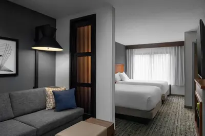 a hotel room with a bed and a couch at Hyatt Place Columbus/Dublin in Dublin