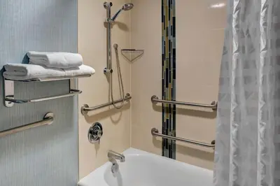 a bathroom with a sink and a shower at Hyatt Place Cincinnati Airport in Florence