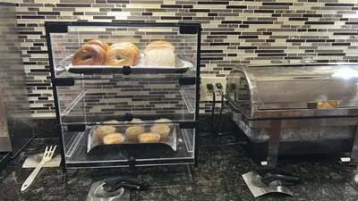 a bunch of donuts are being made in a bakery at Rodeway Inn in Barboursville