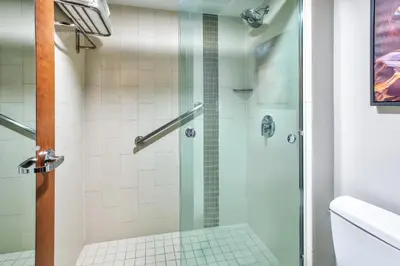 a bathroom with a shower with a glass door at Candlewood Suites - Cincinnati Northeast - Mason by IHG in Mason