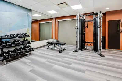 a fitness room with a gym with equipment at Candlewood Suites - Cincinnati Northeast - Mason by IHG in Mason