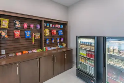 a store with a refrigerator and some food at Holiday Inn Express & Suites - Columbus - Worthington by IHG in Columbus