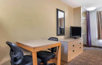 a room with a desk and a tv on a dresser at Extended Stay America Suites - Cincinnati - Blue Ash - Kenwood Road in Blue Ash