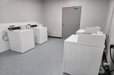 a room full of white appliances in a room at Days Inn by Wyndham Columbus East Airport in Columbus