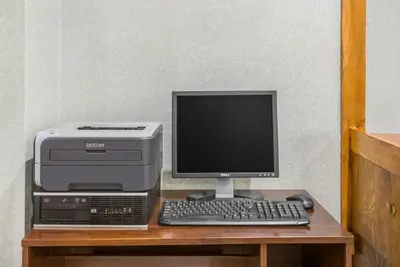 a computer and printer sitting on a desk at Days Inn by Wyndham St Clairsville in Saint Clairsville