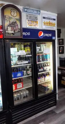 a store with a refrigerator filled with lots of drinks at Davis Motel in North Lima