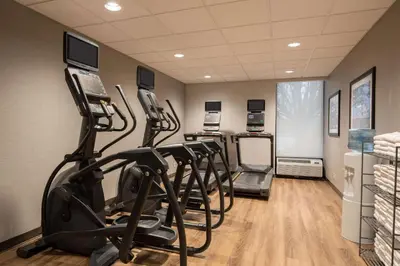 a gym with treadmills and elliptical machines at Drury Inn & Suites Columbus Dublin in Dublin
