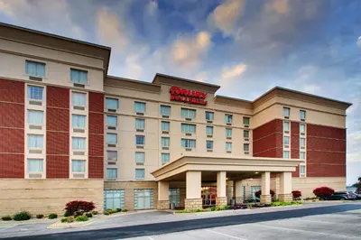a hotel with a sign on the front of it at Drury Inn & Suites Findlay in Findlay