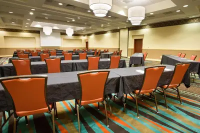 a conference room with a large table and chairs at Drury Inn & Suites Columbus Grove City in Grove City