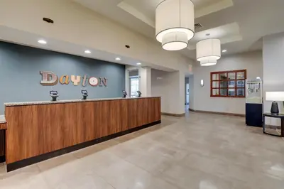 a lobby with a donation sign on the wall at Drury Inn & Suites Dayton North in Dayton
