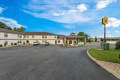 an empty parking lot in front of a hotel at Super 8 by Wyndham Bellefontaine in Bellefontaine