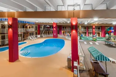 a large swimming pool in a library with red columns at Quality Inn & Suites Richfield in Richfield