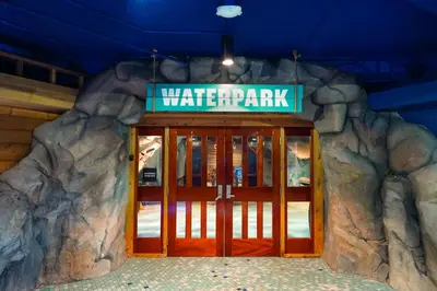 a entrance to a water park with a sign over the door at Castaway Bay by Cedar Point Resorts in Sandusky