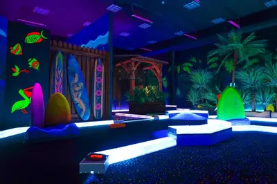 a room with surfboards and plants on the wall at Castaway Bay by Cedar Point Resorts in Sandusky