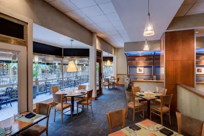 a dining room with tables and chairs and tablesktop at Hyatt Regency Cleveland at The Arcade in Cleveland