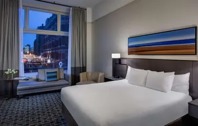 a hotel room with a large bed and a window at Hyatt Regency Cleveland at The Arcade in Cleveland